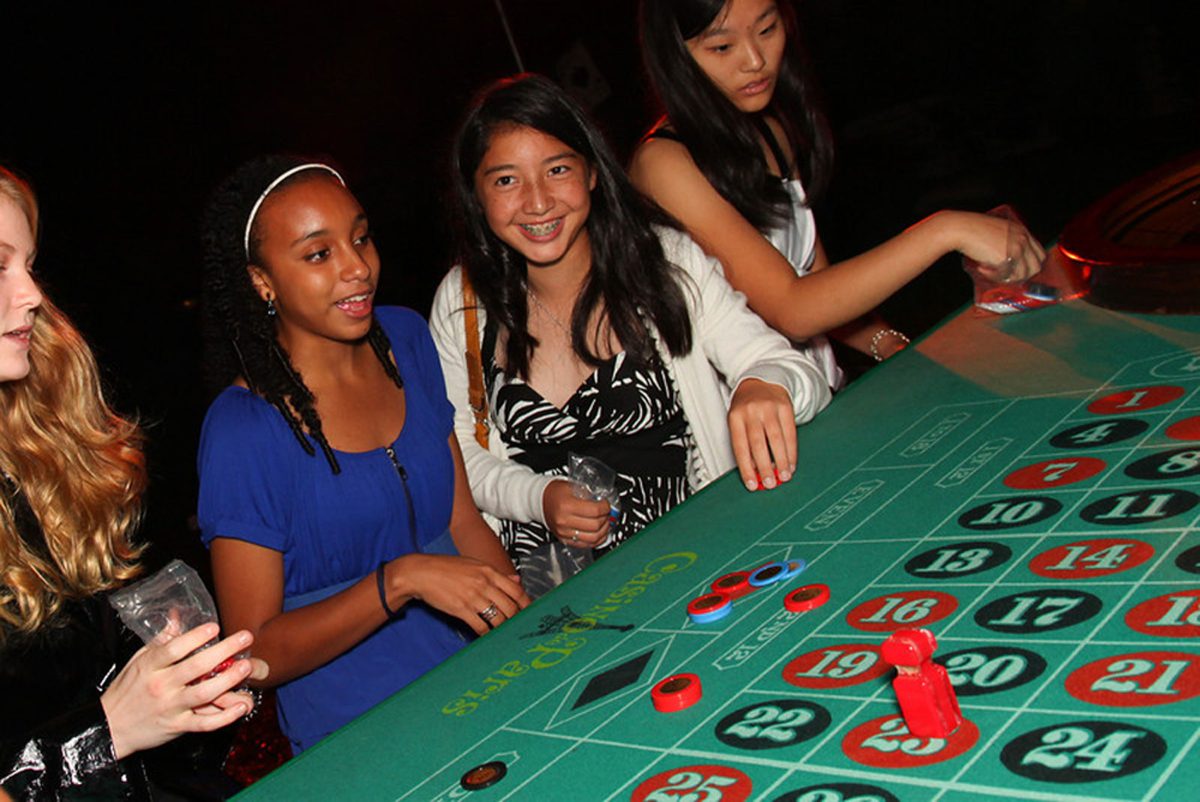 BLACKJACK: Shalena 14, Sydney 14, and Caroline 14 played at a roulette table during Casino Night. Photo courtesy of Rand Bleimiester. 
