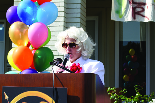 PRESIDENT SNOW: Head of School Barbara Wagner, in costume as President Snow, addresses the nation of Panem during the Hunger Games opening ceremony. Photo courtesy of Alice 11
