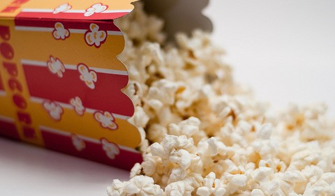 Popcorn often eaten at movies. Photo by flickr user o5com. 