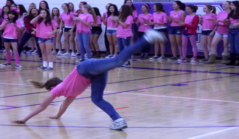 A 7th grader performs a cartwheel during the 7th Grades winning lip sync performance. Photo by Isabel Bleimeister