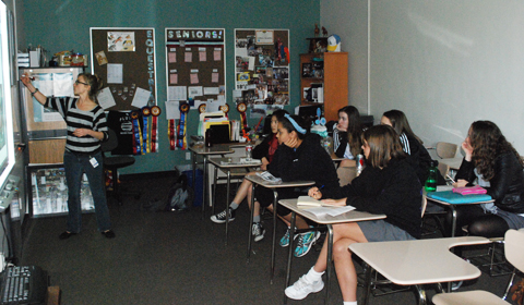 DARE TO EXPLORE: Students listen intently to physicist Auna Moser explain a CalTech plasma experiment. Photo by Alex 14. 