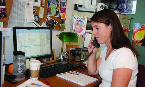 English instructor Sarah Wolf waits for a dial tone, but realizes the Marlborough phones are not working. Photo by Claudia '15.