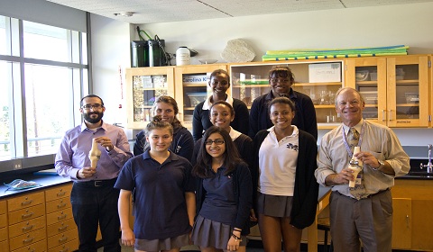 Members of the robotics club and their team leader Andrew Witman pose with Dr. Jack Tauber after his lecture on working with Glendale Adventist Medical Center's knee replacement robot. Photo by Chris Colthart.