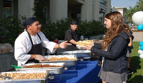 José Luis Morales serves a tostada to Sasha 15 at Culinarts Mexican BBQ. Photo by Ana 15.