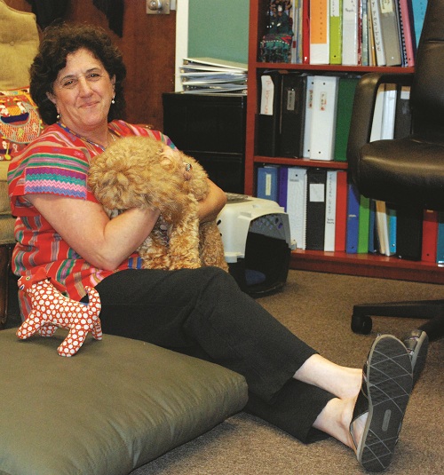 School Counselor Emily Vaughn with Mitzi Doodle, her miniature labradoodle.Photo by Lori '14.