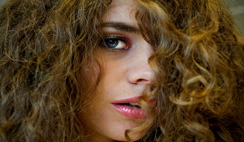 Turn seemingly unmanageable frizz into tight curls. Photo by Flickr user Martin de Witte.