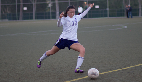 Morgan Sasaki '15 punts the ball down the field on Feb.12 against Cavalry Chapel Christian School Sarane Caratan / Staff Photographer