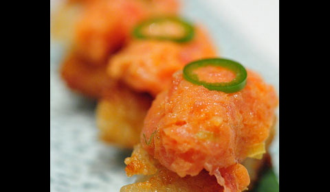 Fresh spicy tuna sits on a block of crispy rice to make Katsuyas famous dish. photo by Flickr user maveric2003
