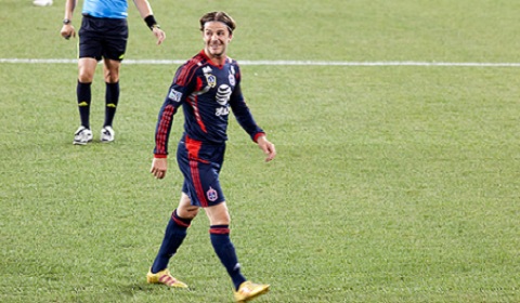 Beckham smiles on the soccer field. Photo by flikr user nasmac.