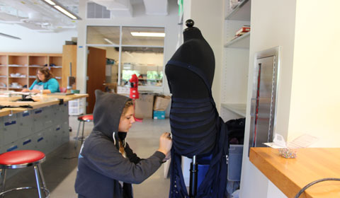 Photo by Ariella ’15 Angelica ’14 sews a dress out of old Marlborough uniforms. 