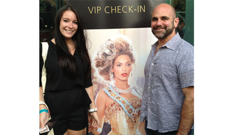 Talone and Anastasi pose next to a picture of Beyoncé by the entrance to the VIP Check-In at the July 1 show of The Mrs. Carter World Tour. Chris Talone / Contributor