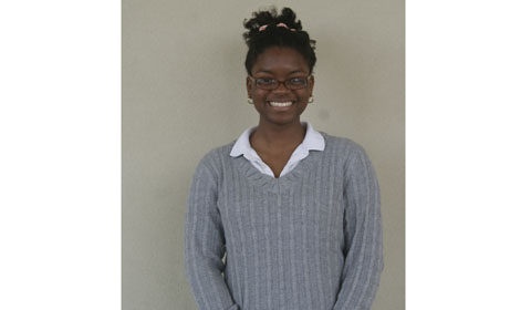 AACE club member Kamilah 15 smiles for a photo.
Photo by 