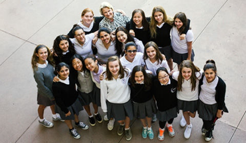 Wagner shares smiles with current Marlborough girls from 7th grade through 11th grade. Photo by Chris Colthart.