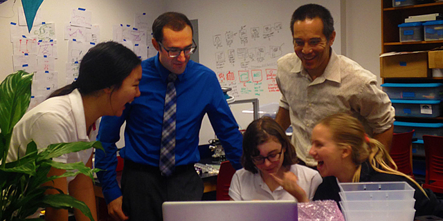 Kessner and Witman oversee students STEM coding projects. Photo by Clementine 17