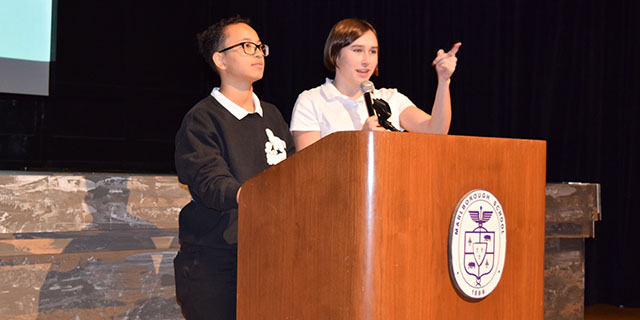 Two of Alliances co-presidents, Alden 17 and Rebecca 17, speak at the ASM.
Photo by Paige 17