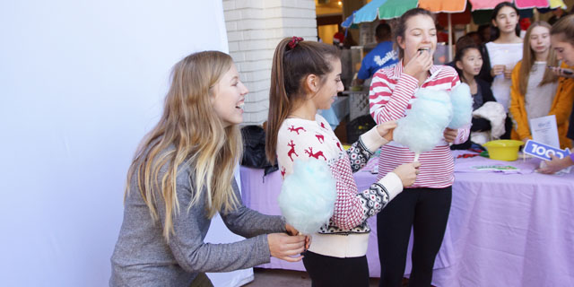 Jordan Trester '18, Corrie Phillips '18 and Olivia White '18 pose for photos during Winter Fest. Photo by Chris Colthart.