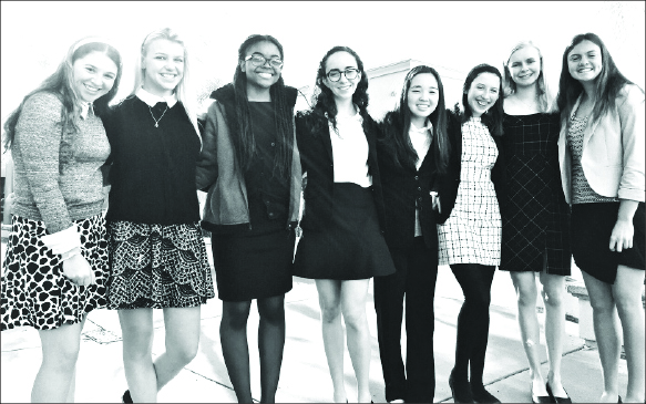 Maddie 18, Nina 18, Malaika 18, Allie 19, Julia 20, Anna 19 and Megan 19 pose outside Laguna beach high school at a MUN conference. Contributing photographer Max Duncan.