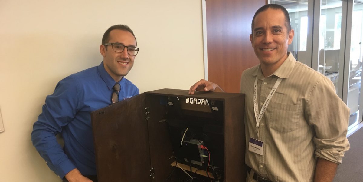Kessner and Witman with their arcade game. Photo courtesy of Nia 19.