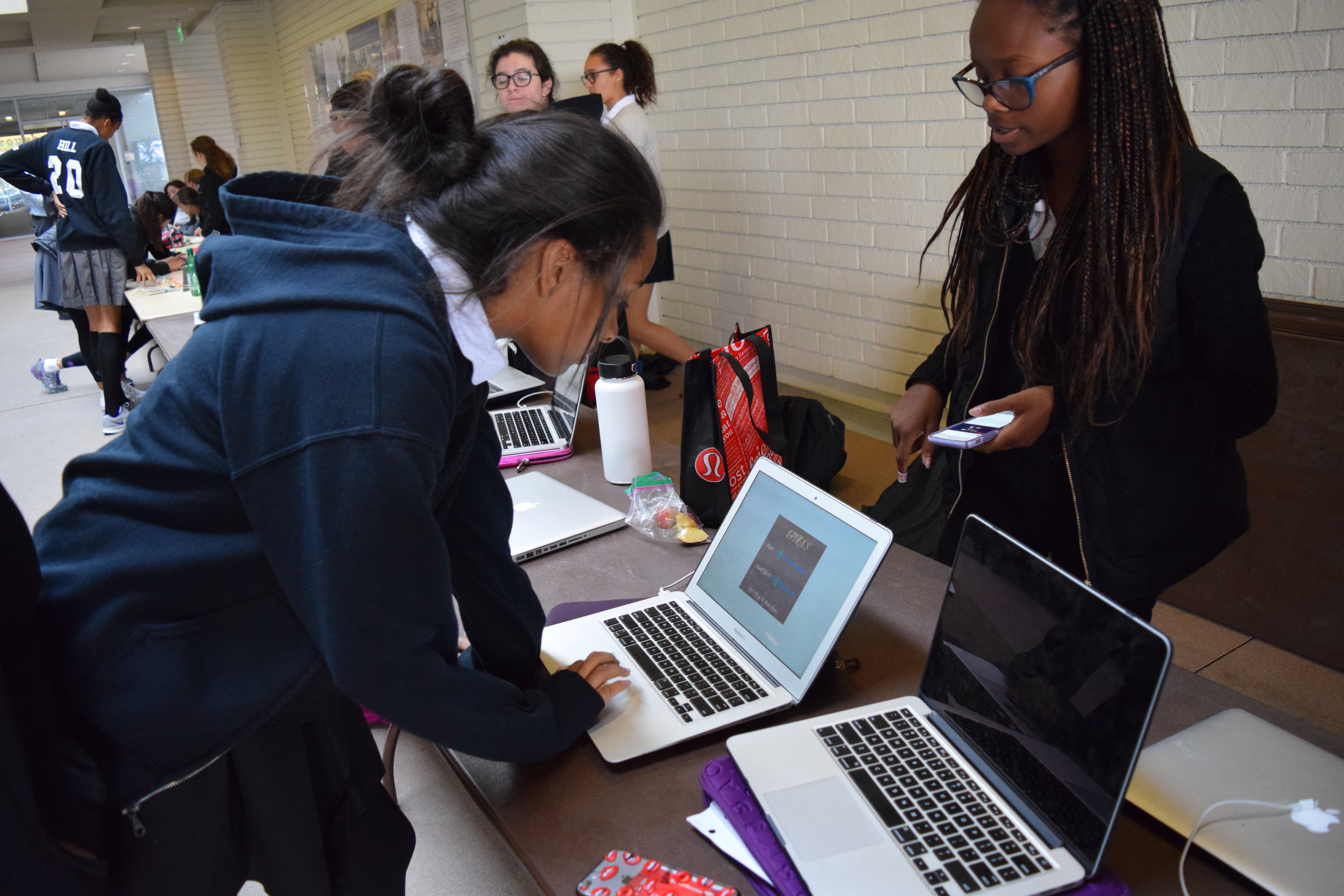 Kendall L. '18 and Kendall R. '18 play a student-coded game.