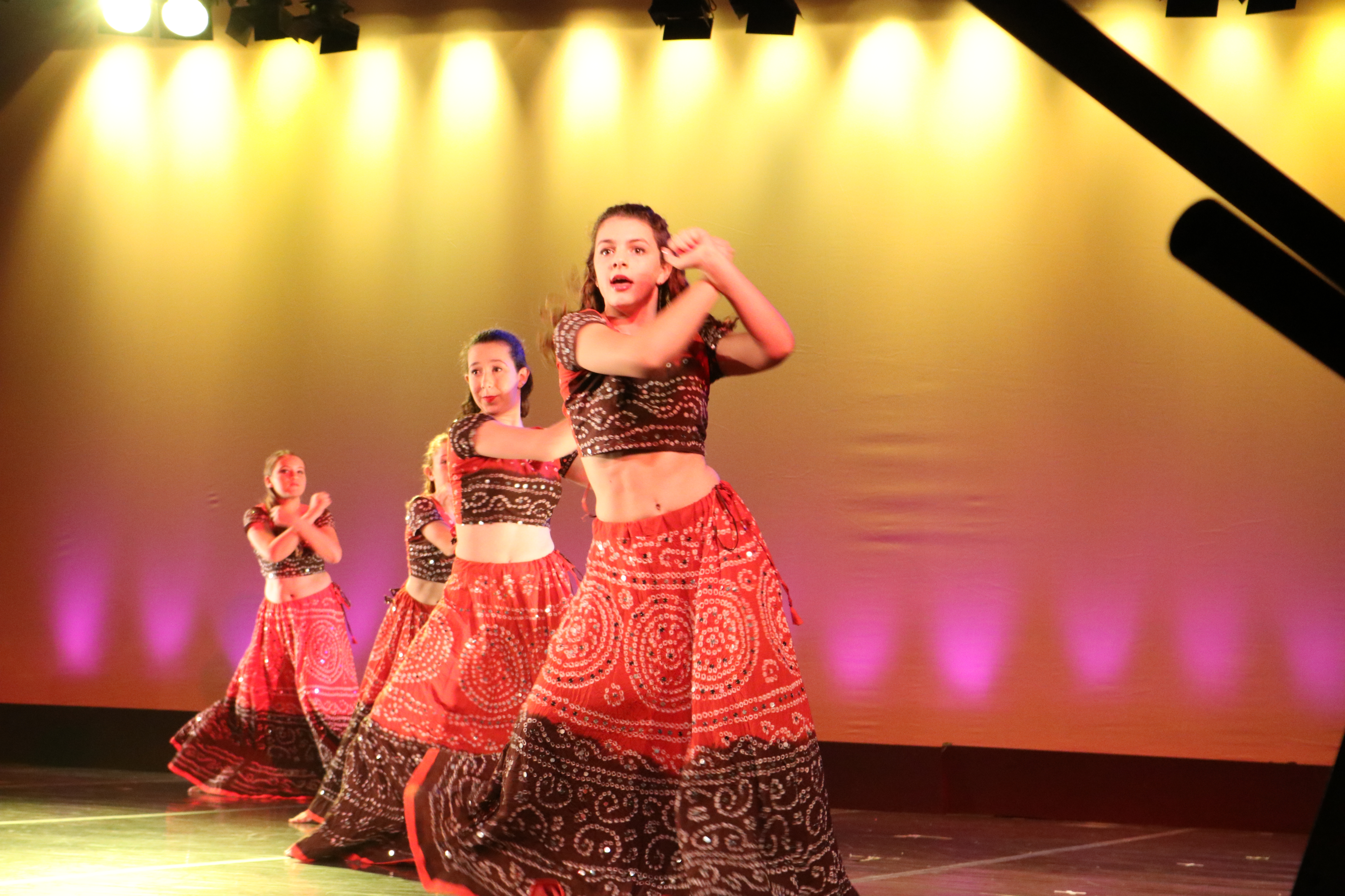 Cate Herman ’21, Mira Chaskes ’20 and Nina Fisher ’22 dance a Bollywood-inspired routine.
