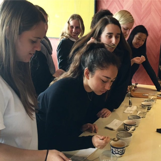 Olivia ’17 and the entrepreneurship class taste test a variety of drinks from Rubies + Diamonds.  