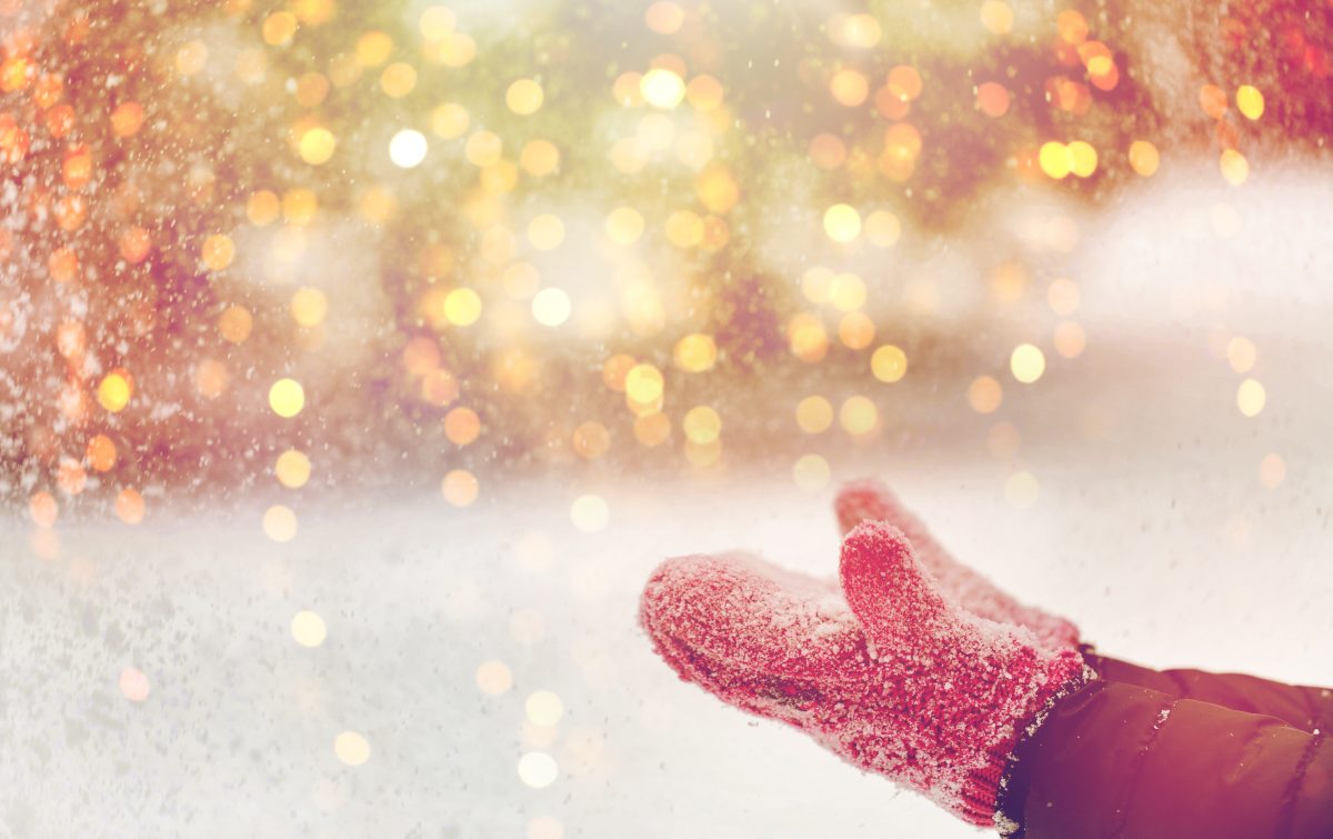 winter holidays, christmas and people concept - close up of woman throwing snow outdoors