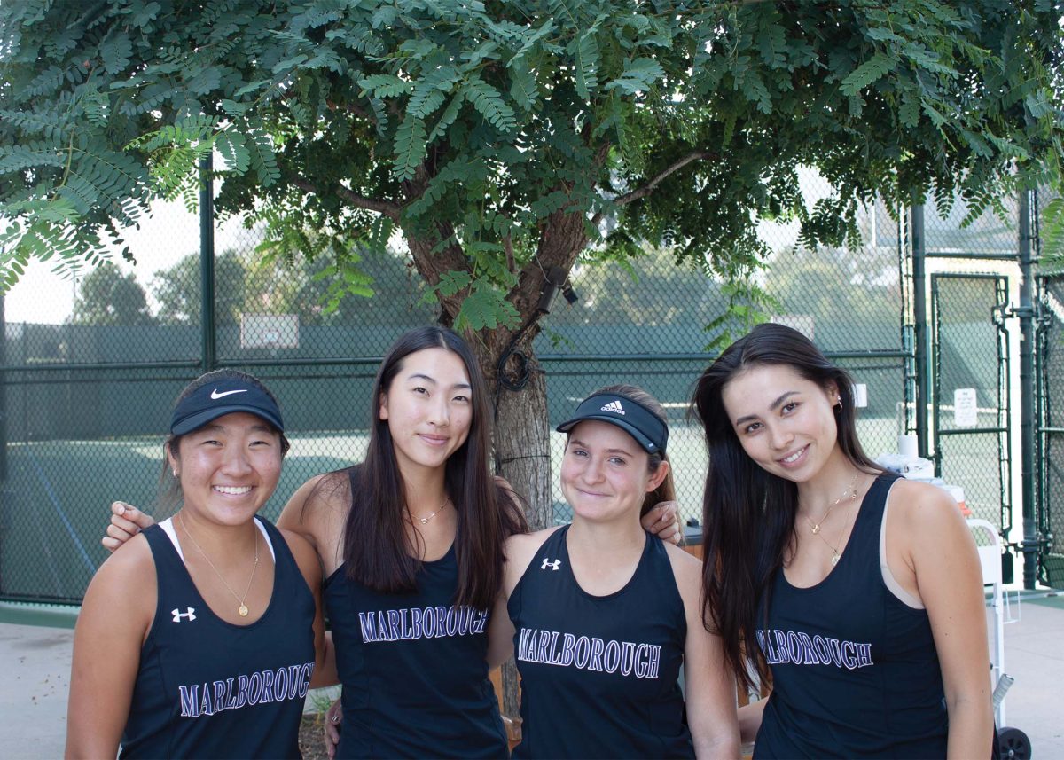 Varsity tennis team members Isabella ‘25, Mia ‘26, Leah ‘26, Ava ‘23 pre-match.
