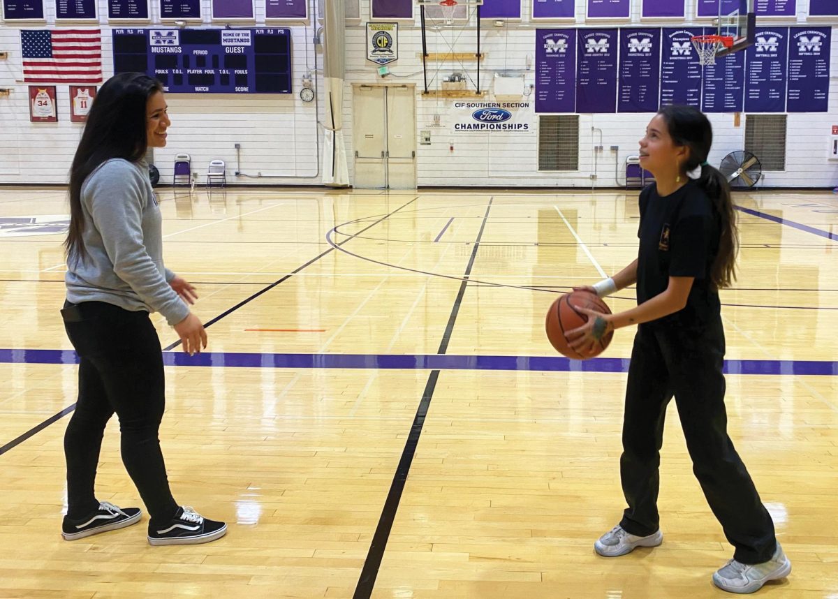 Assistant Athletic Director Jessica Romero passes a basketball around with Caroline ’28.
Addison 26 Staff Photographer