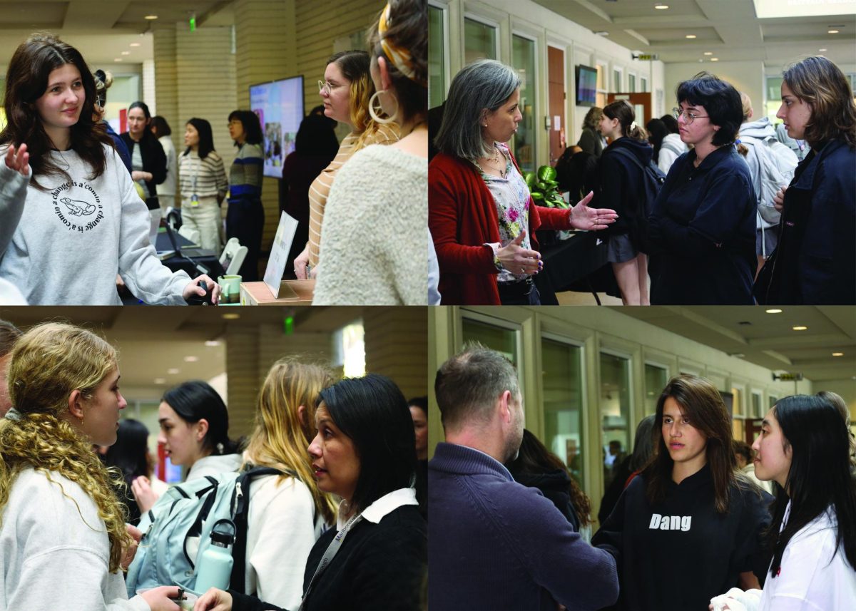 Students discuss class plans with faculty at the course fair.