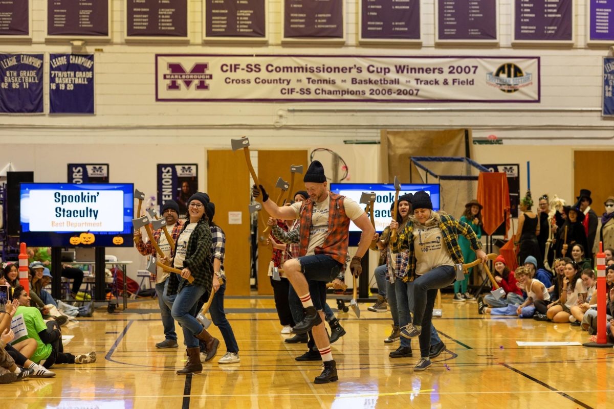 Teachers from the Mathematics Department dancing at the Pumpkin Day parade.