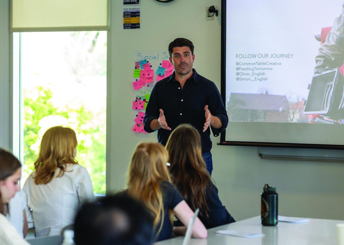 Oliver English speaks to students.