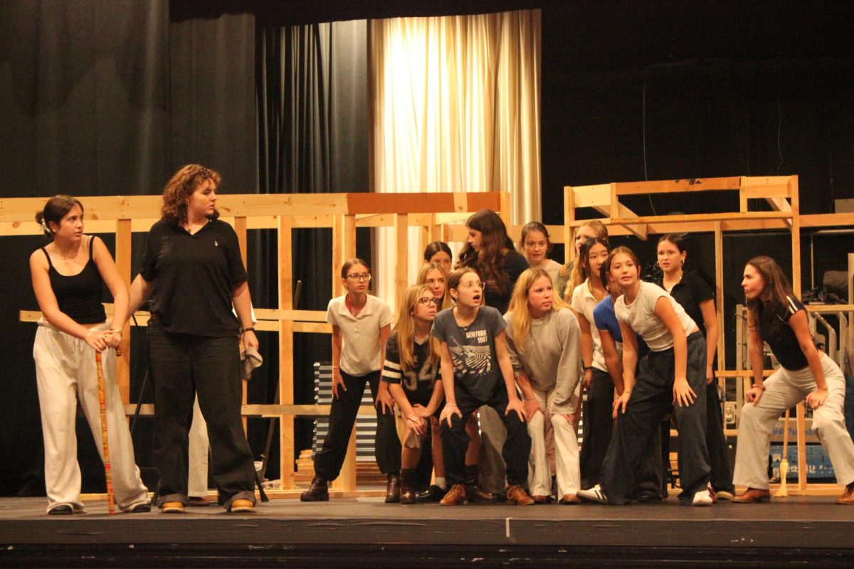 "Urinetown" cast rehearses a number.