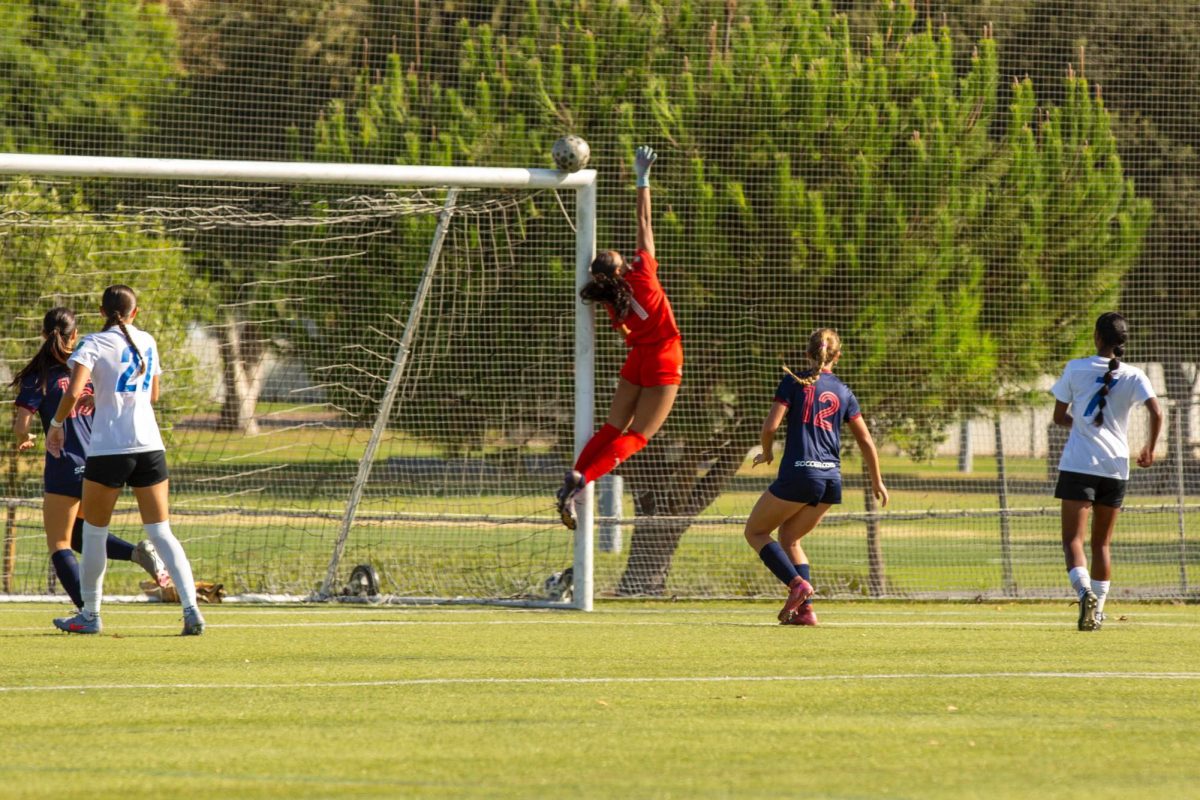 Ria '26 blocks a goal in a club soccer match