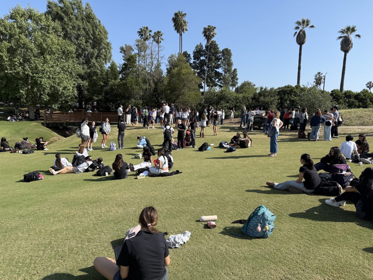 Students wait at the Wilshire Country Club for parents to pick them up.